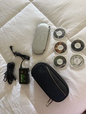 Sony Silver PSP Slim with Black Carry Case and UMD Game Discs